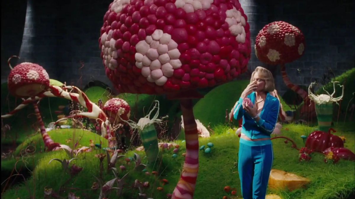 A bulbous mushroom tree. A woman in a blue tracksuit stands beneath it. 