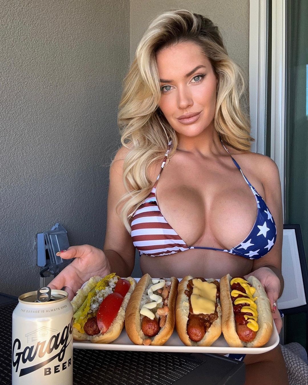 Paige celebrated the US Open in a stars and stripes bikini, eating hot dogs
