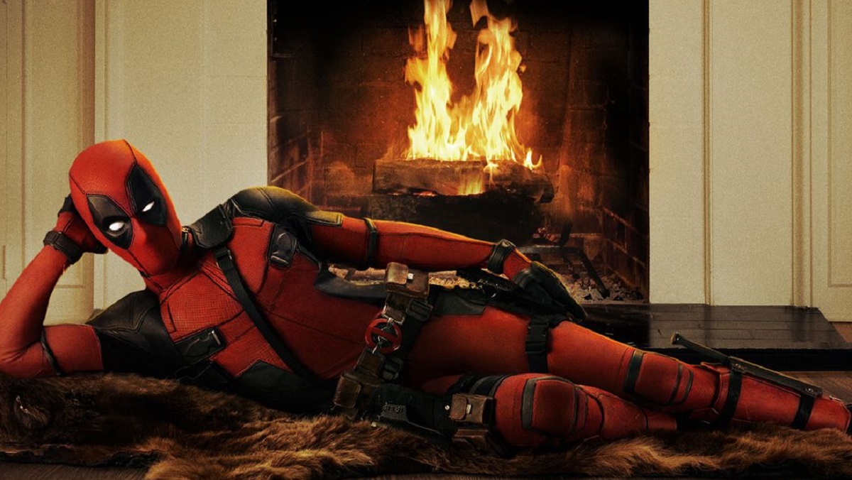 Deadpool lounging in front of the fireplace.