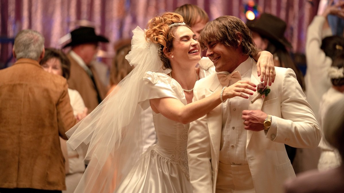 Lily James and Zac Efron hugging at their wedding in The Iron Claw