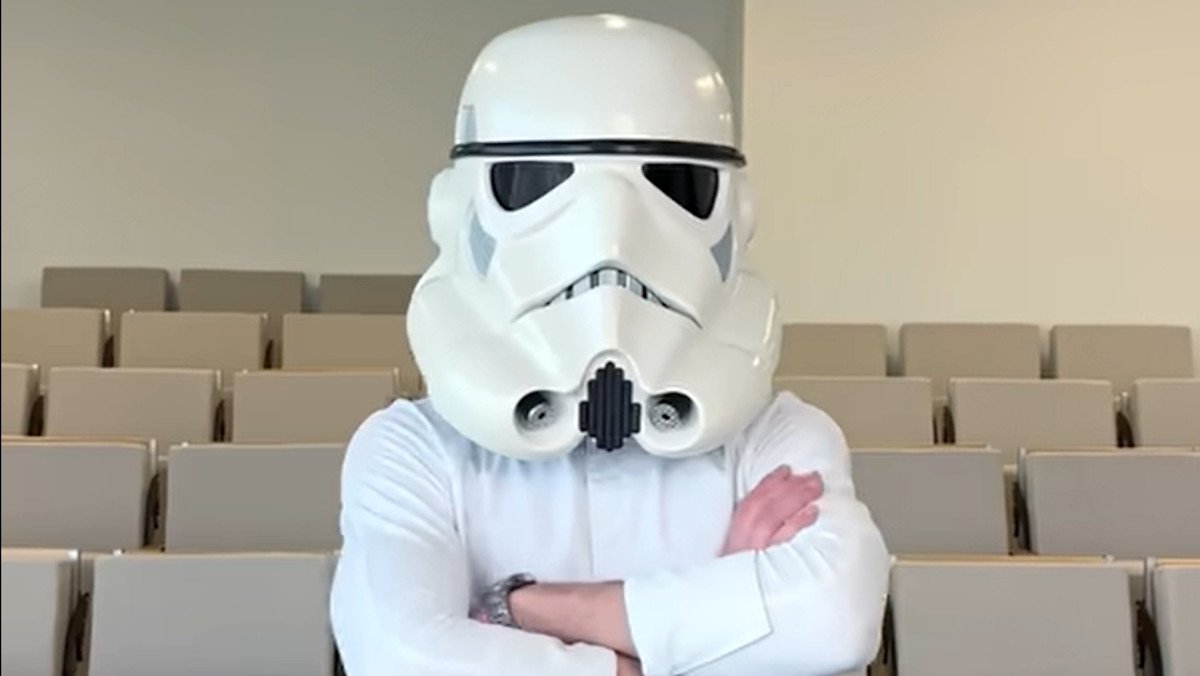 Pastry chef Amaury Guichon wears a fully decorated, wearable chocolate stormtrooper helmet in a classroom