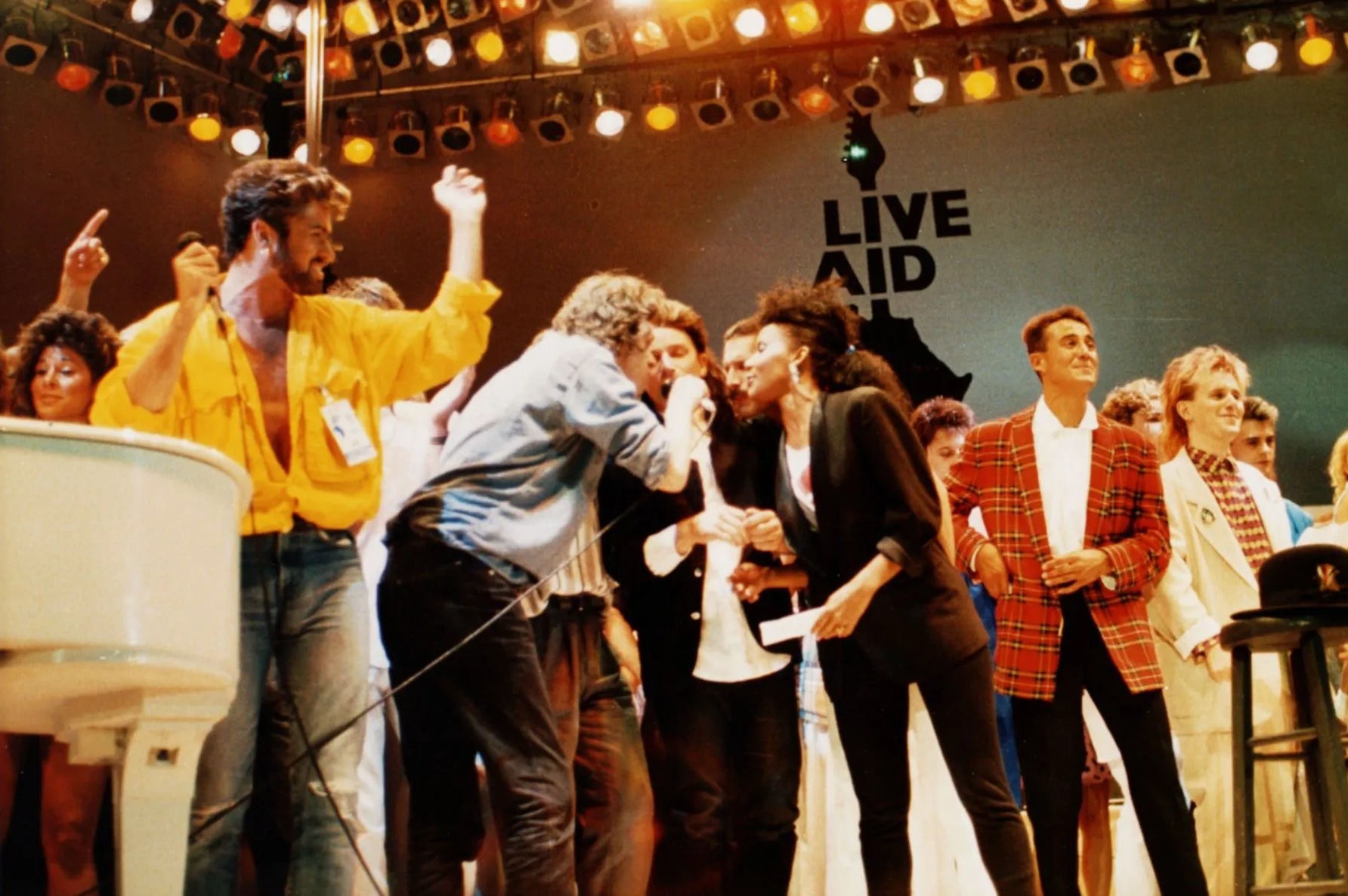 George Michael, Bob Geldof, Bono, Freddie Mercury, Andrew Ridgley and Howard Jones at the Live Aid Concert