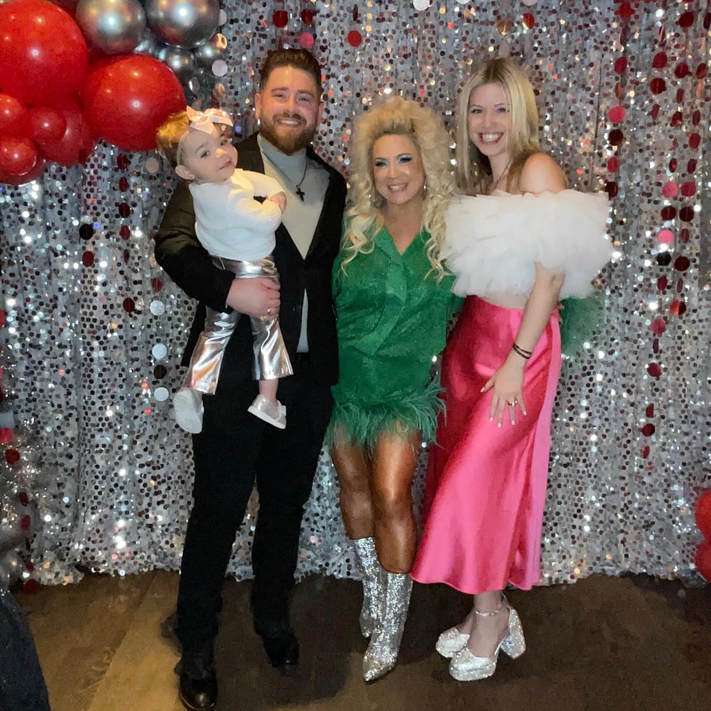 The Long Island Medium posed with her son Larry Caputo and his wife Leah Munch, and granddaughter Michelina Rose