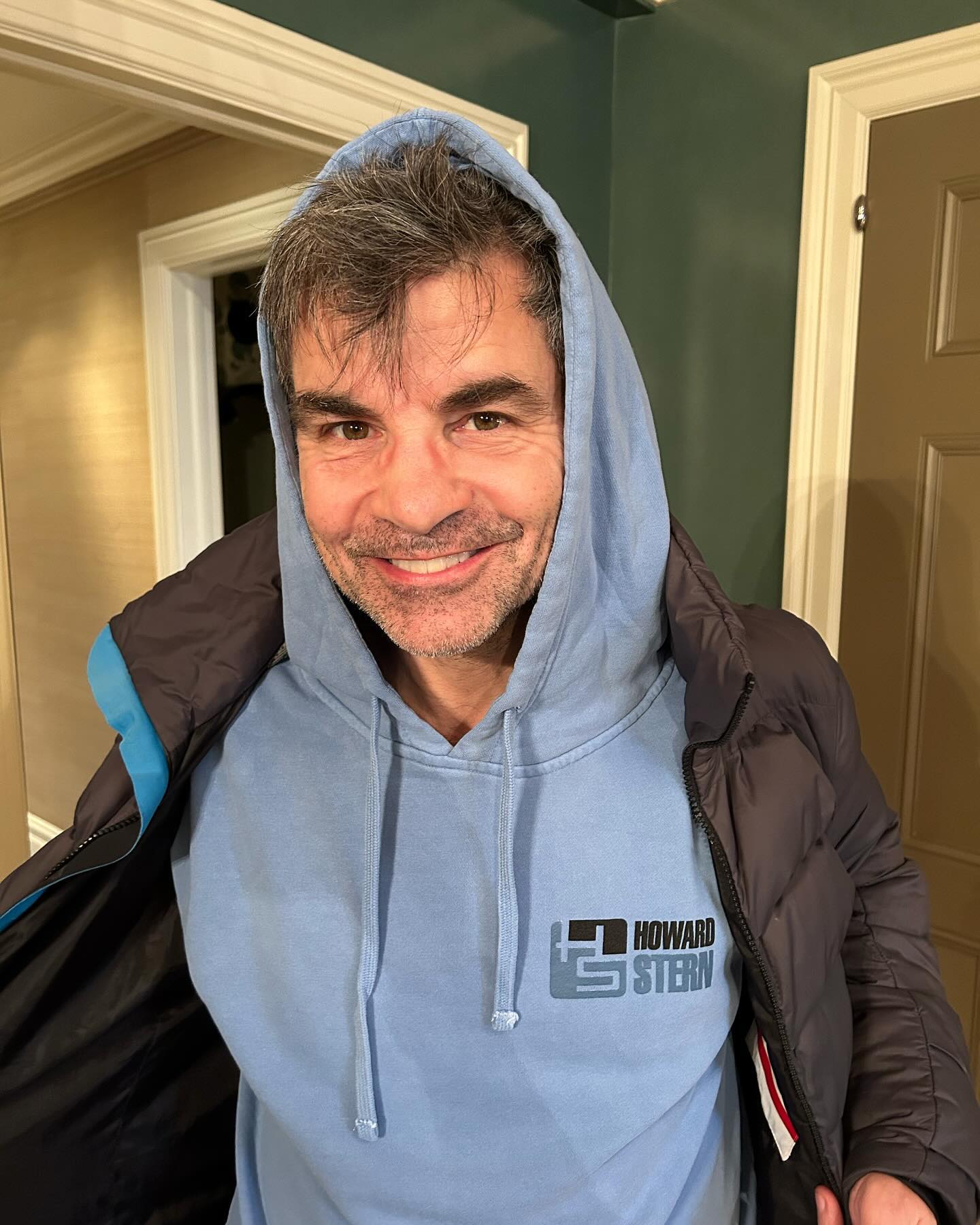 George donned a hoodie and some unexpected scruff he's seemingly grown out while away from GMA