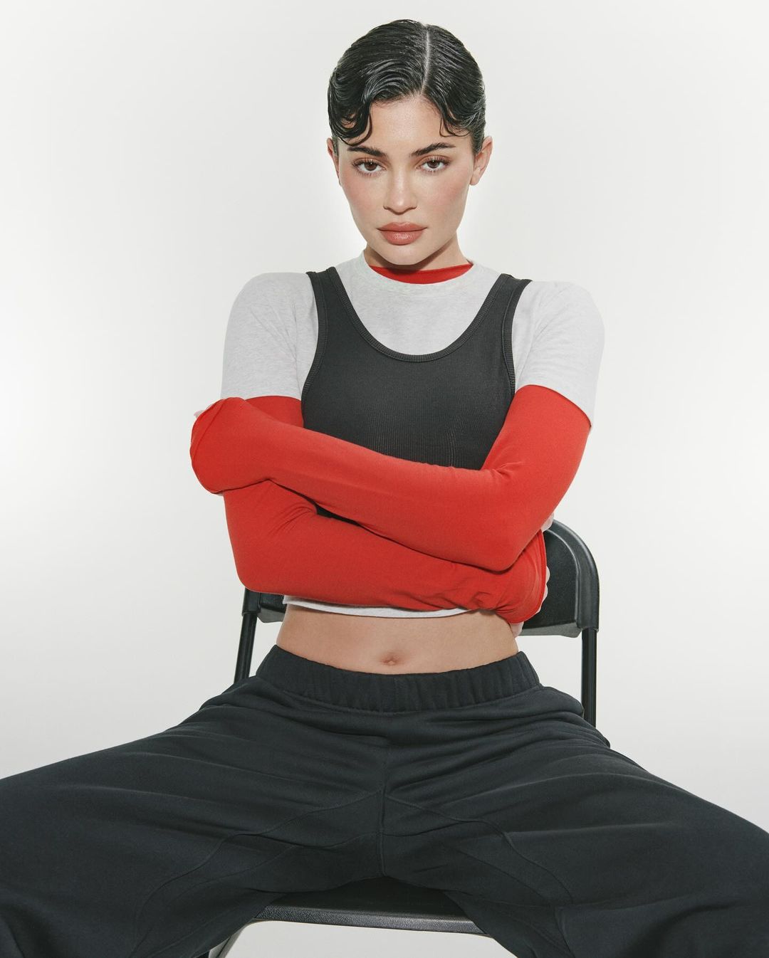 The Hulu star posed in low-rise sweatpants and a matching crop top as fans called the new Khy by Kylie Jenner items 'basic'