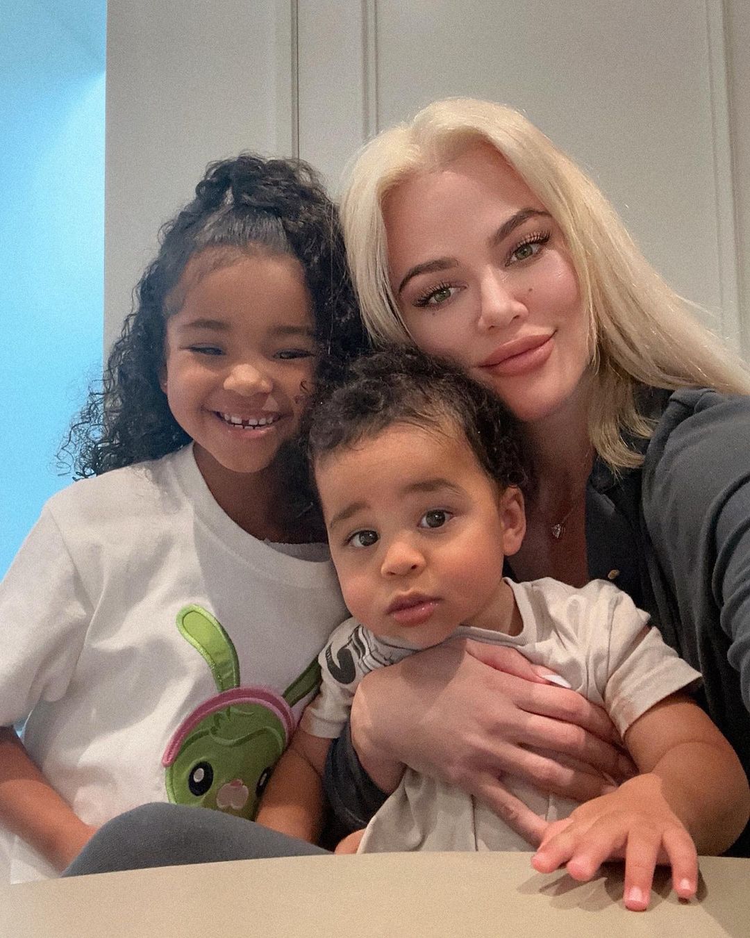 Khloe pictured with her kids True and Tate Thompson