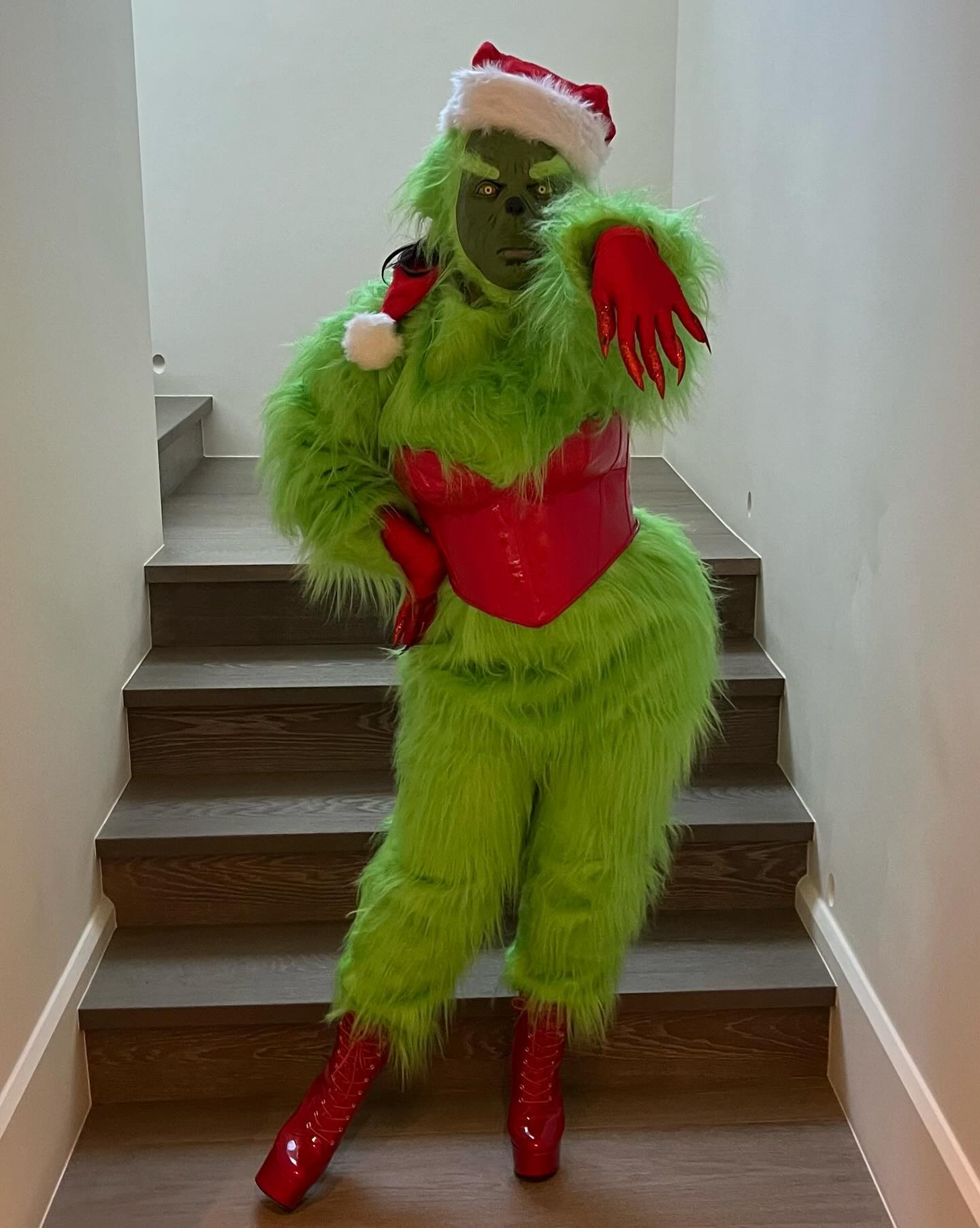 She transformed into The Grinch with her furry green costume