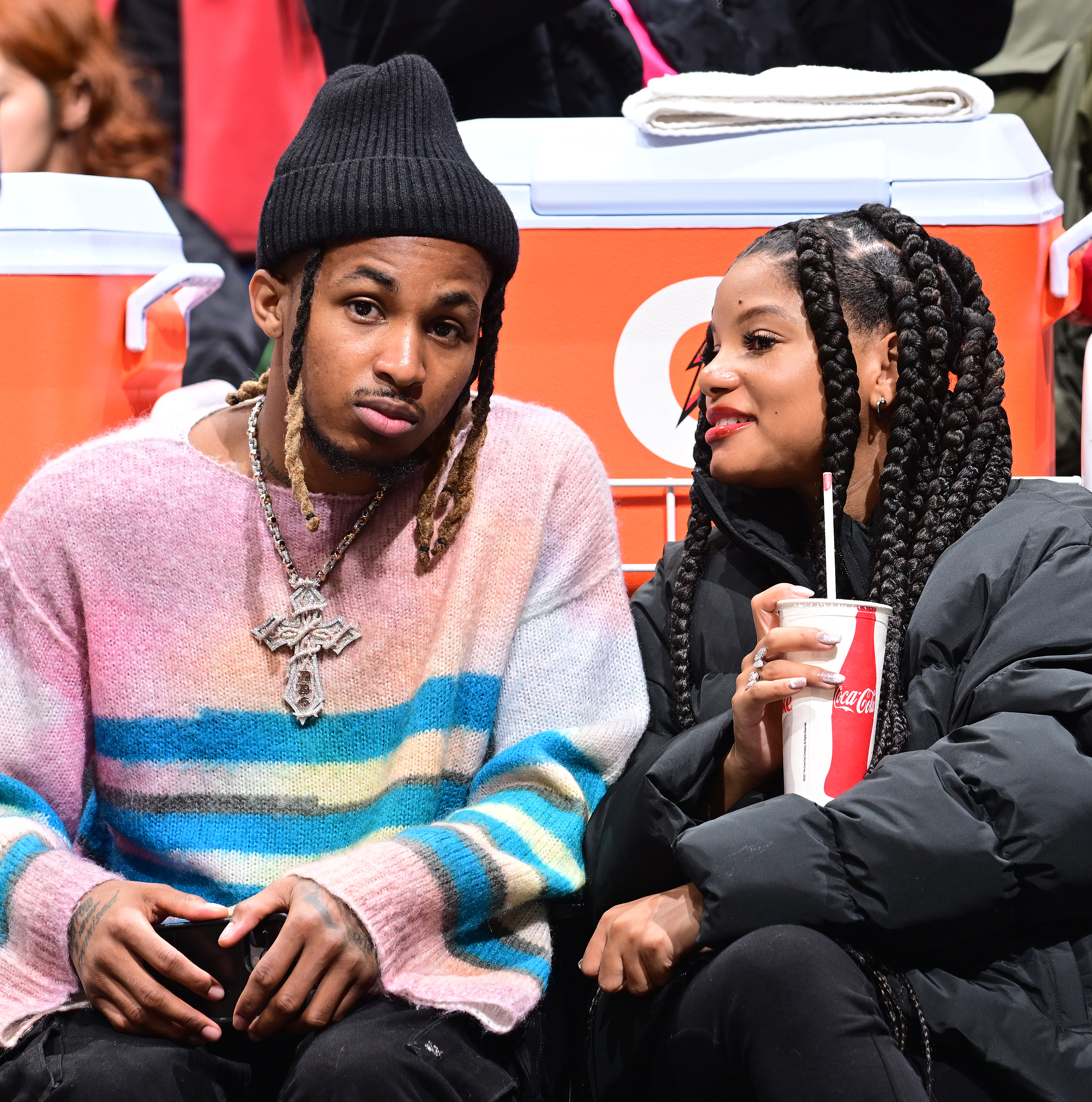 Halle Bailey and DDG attend an NBA game between the Golden State Warriors and the LA Clippers