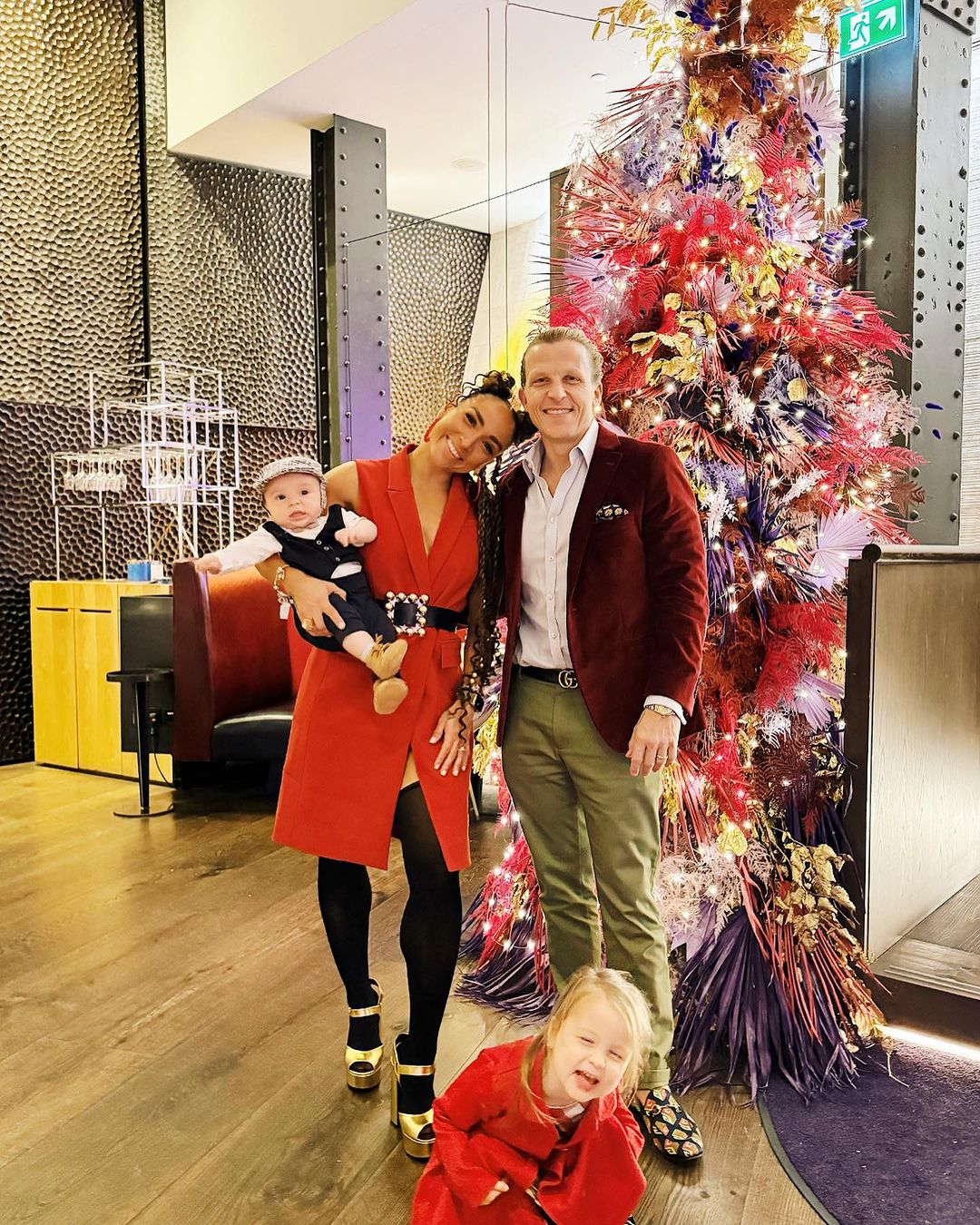 Robin Arzón and Drew Butler celebrate with their children in London, England