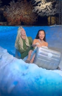 Kim and Paris rode on an inflatable flying carpet snow sled at the event