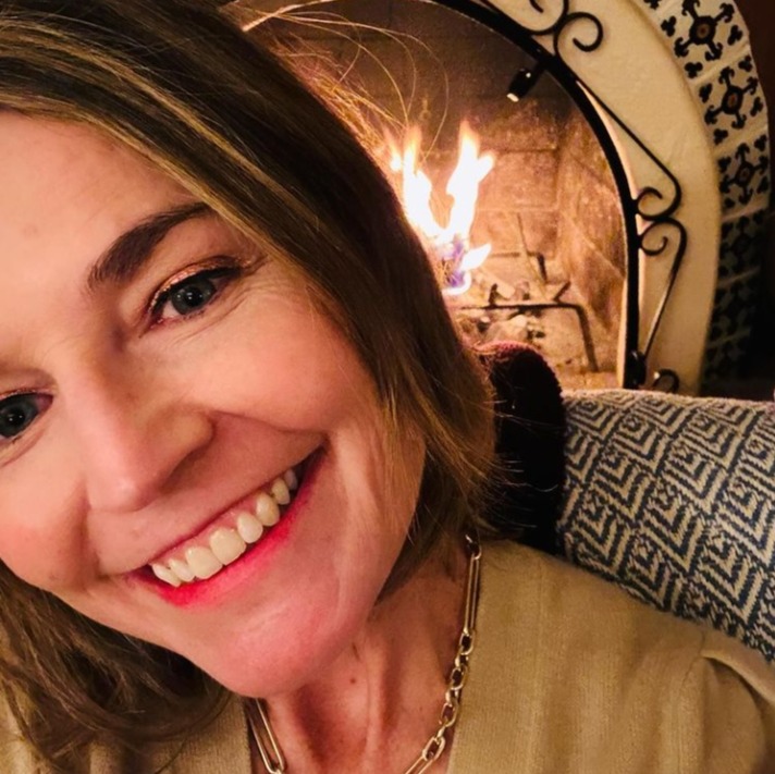 The star smiled in a new selfie in front of her fireplace