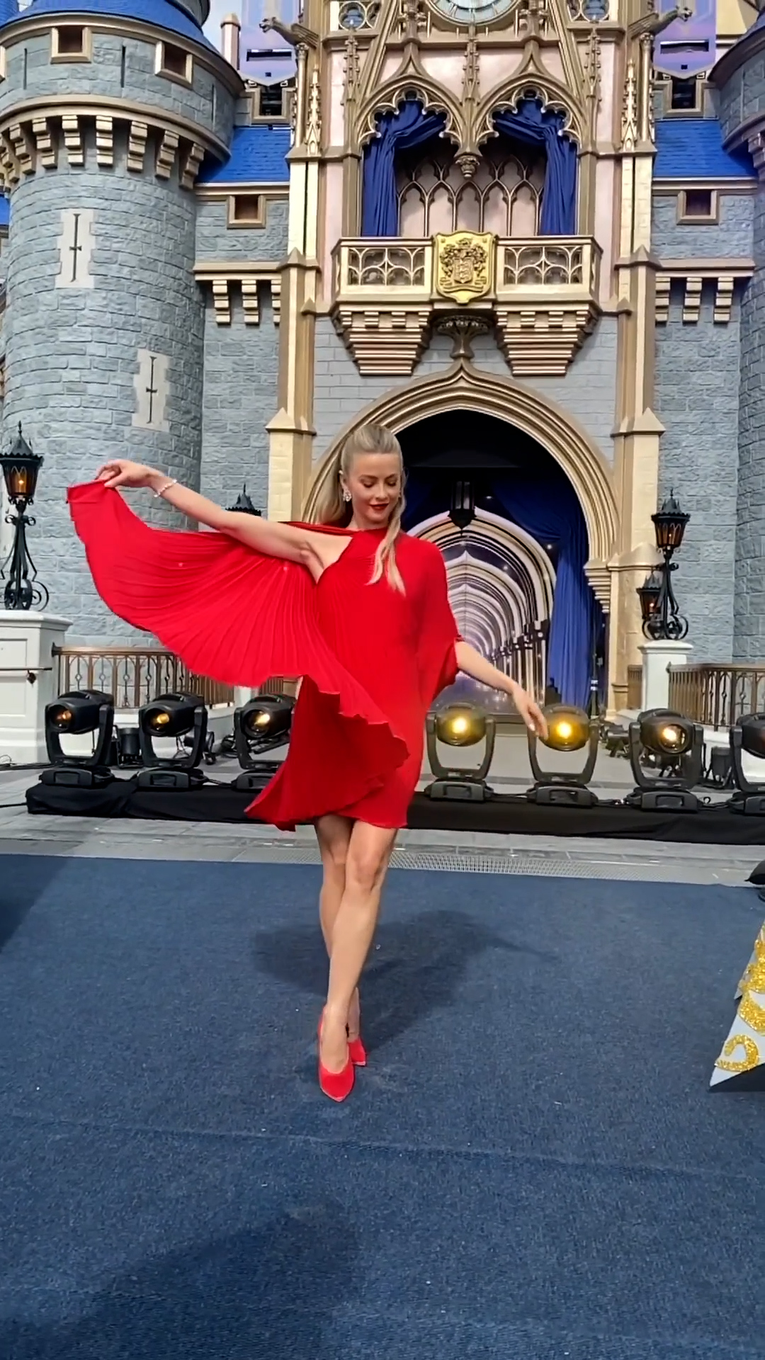 Julianne wore a red dress during The Disney Parks Magical Christmas Day Parade special