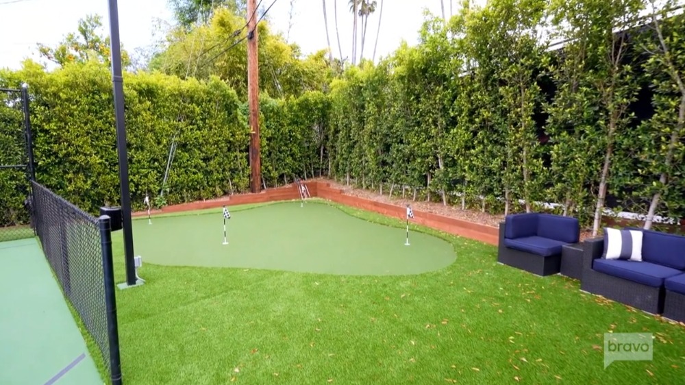 The Wileys built a golf course in their backyard after adding turf to the grass