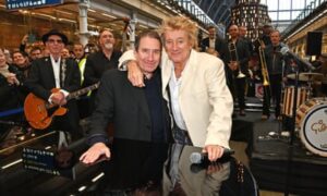 Sir Rod Stewart and Jools Holland hold a surprise performance at St Pancras on 5 December.