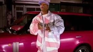 Cam'ron in front of pink Range Rover