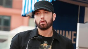 Eminem's daughter Alaina Scott has shown off her huge tattoo in a rarely-seen place as she poses with her husband