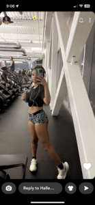 Halle Bailey shared a full-body gym selfie that showed her flaunting her bare stomach and legs in a crop top and tiny biker shorts