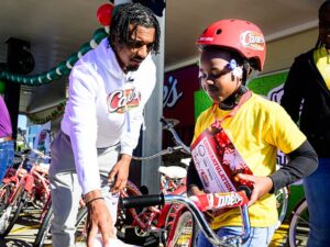 Heisman Winner Jayden Daniels Helps Raising Cane's Donate Bikes For Holidays