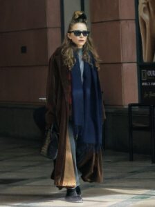 Mary-Kate Olsen wore an over-sized coat and along scarf during her rare sighting