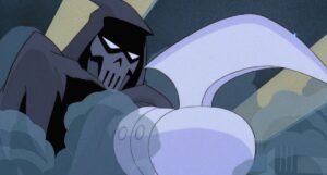 The Phantasm in Batman: Mask of the Phantasm, a vigilante in a grey cowl and deaths-head mask, with one arm ending in a huge metal cap with a blade sticking out of it