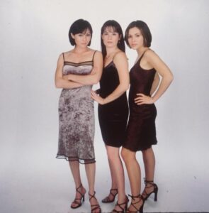 Shannen Doherty, Holly Marie Combs, and Alyssa Milano in a promotional photo for