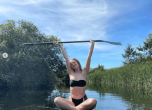 Skins Star Lily Loveless Shares Swimsuit Photo of “Peace”