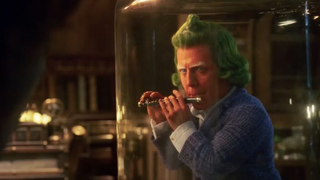 Hugh Grant’s Oompa Loompa plays a flute in Wonka