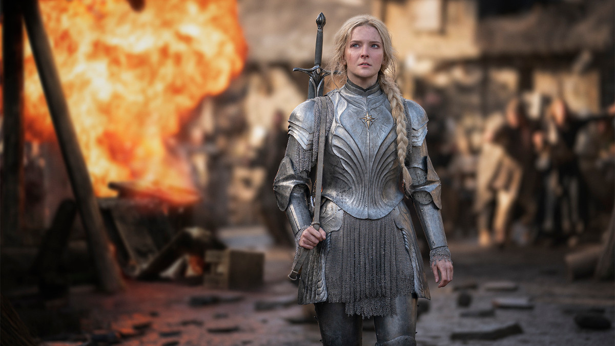 Galadriel in armor standing in front of a battlefield in The Rings of Power in Prime Video ad and price increase article.