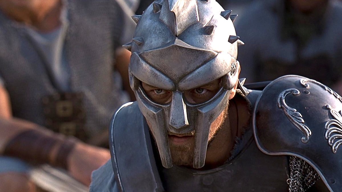 Russell Crowe's Maximus with his mask on crouching in Gladiator