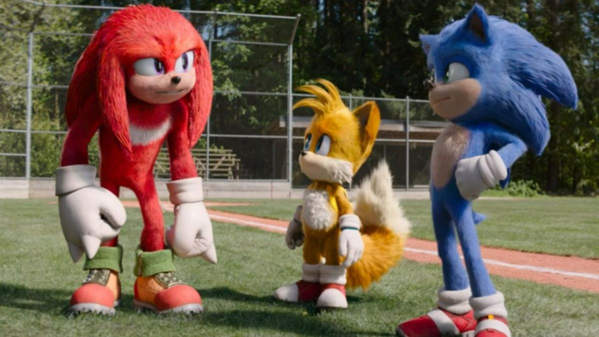 Sonic the Hedgehog, Knuckles the Enchinda, and Tails stand together on baseball field