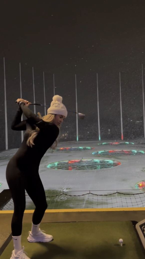 Hart recently braved the cold weather to hit a snowy golf range