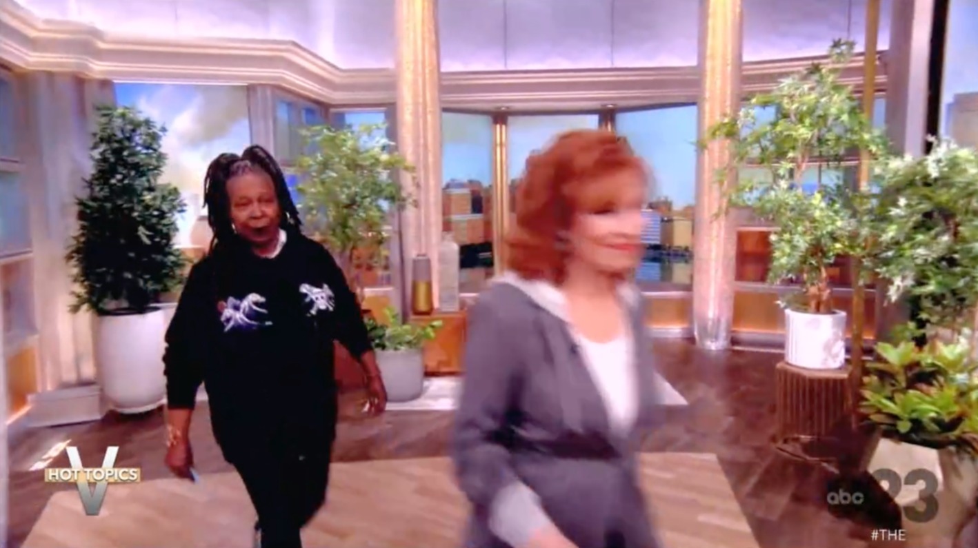 Whoopi's dreadlocks were pulled out of her face, letting her skin and facial structure shine