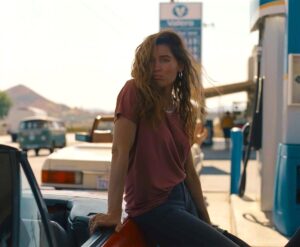 A woman leans against her car at a gas station in "Monica."