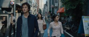 Ren Watabe, Qyoko Kudo and Anna Sawai walking down a street in suburban Tokyo