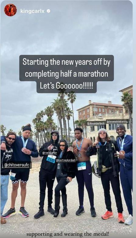 Kourtney teased her post-baby body in a full-length pic that captured her supporting Travis as he ran a marathon in Santa Monica, California