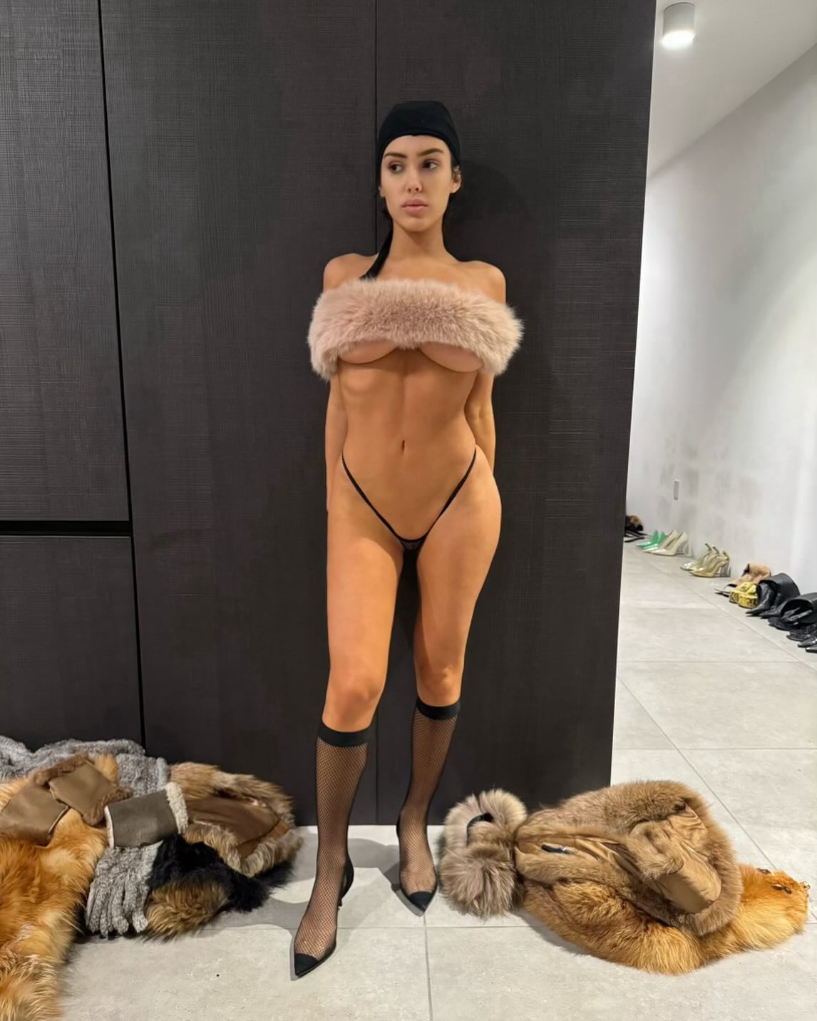 Kanye posted a risque photo of Bianca wearing a furry shawl