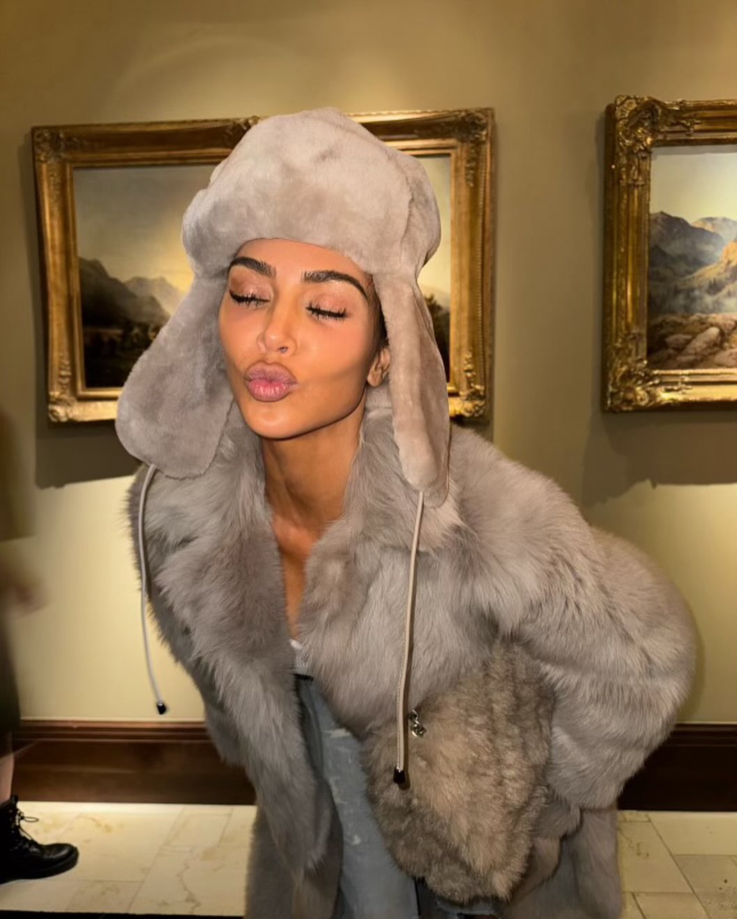 Kim posed in a furry hat while on a snowy vacation