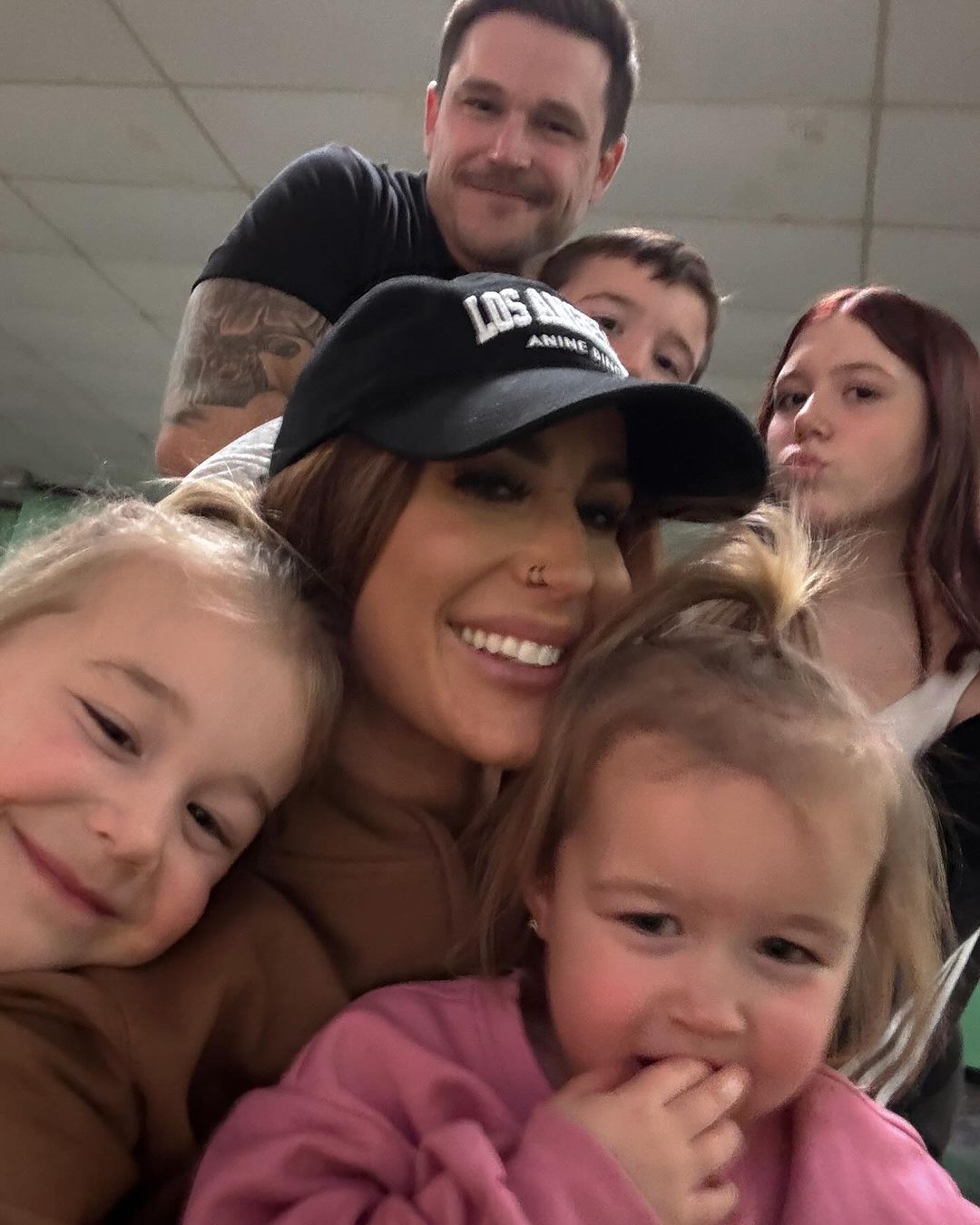 Chelsea Houska and Cole Deboer posed with their children