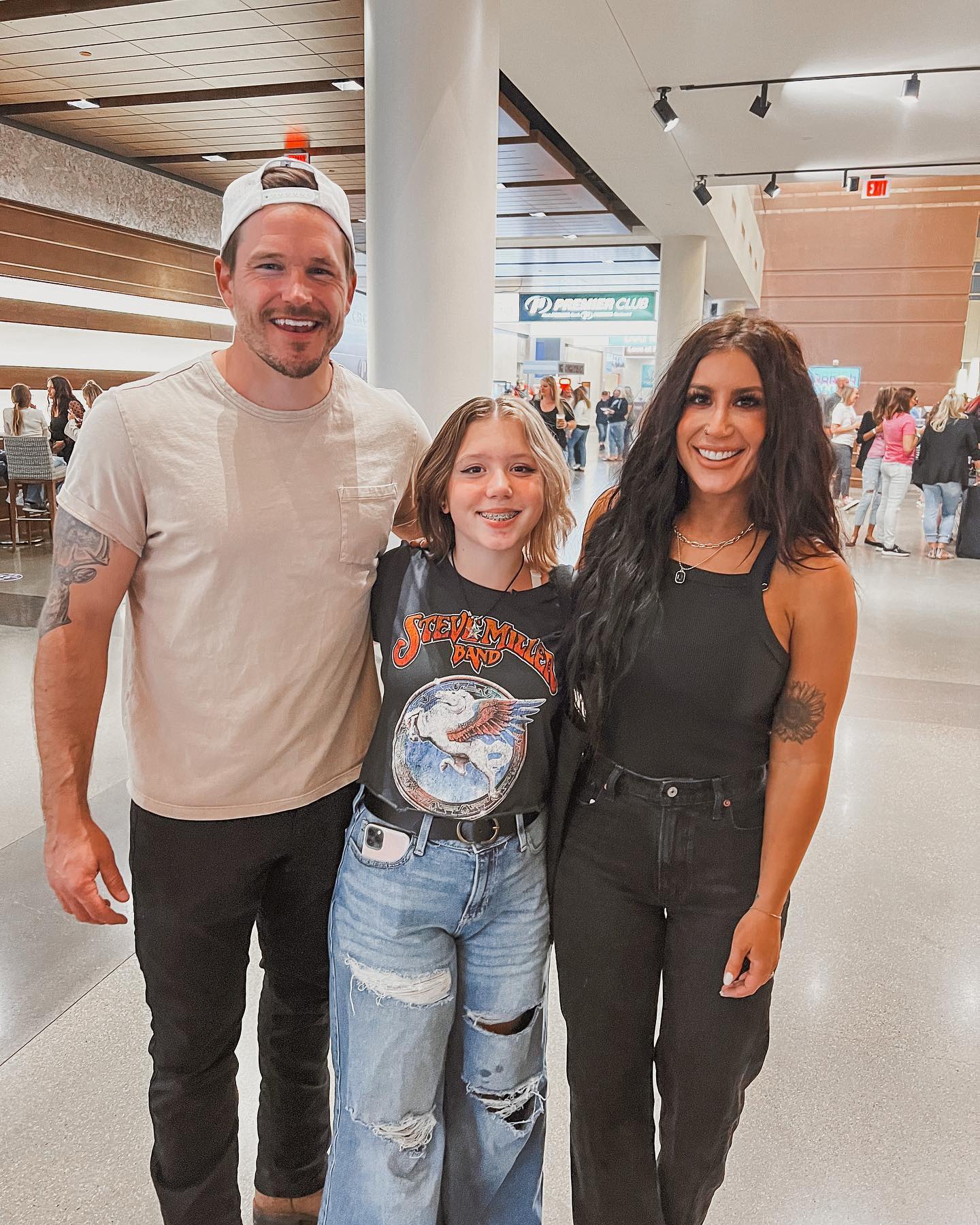 Chelsea pictured with dark hair as she posed with Cole and Aubree