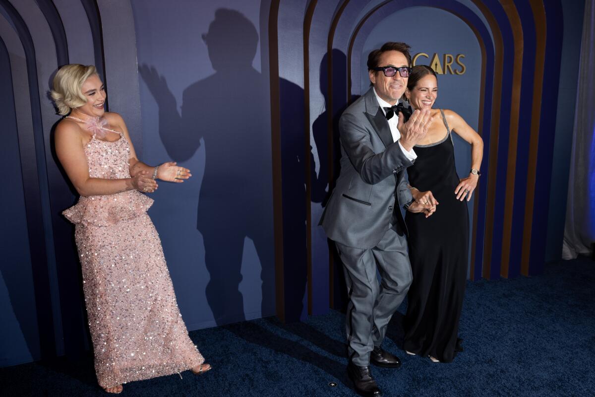 Florence Pugh, Robert Downey, Jr., and Susan Downey