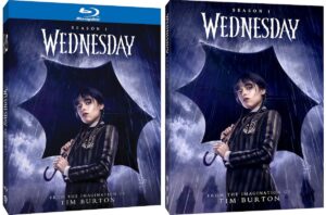 The Blu-Ray box and DVD box for Wednesday's home release, each with her holding an umbrella