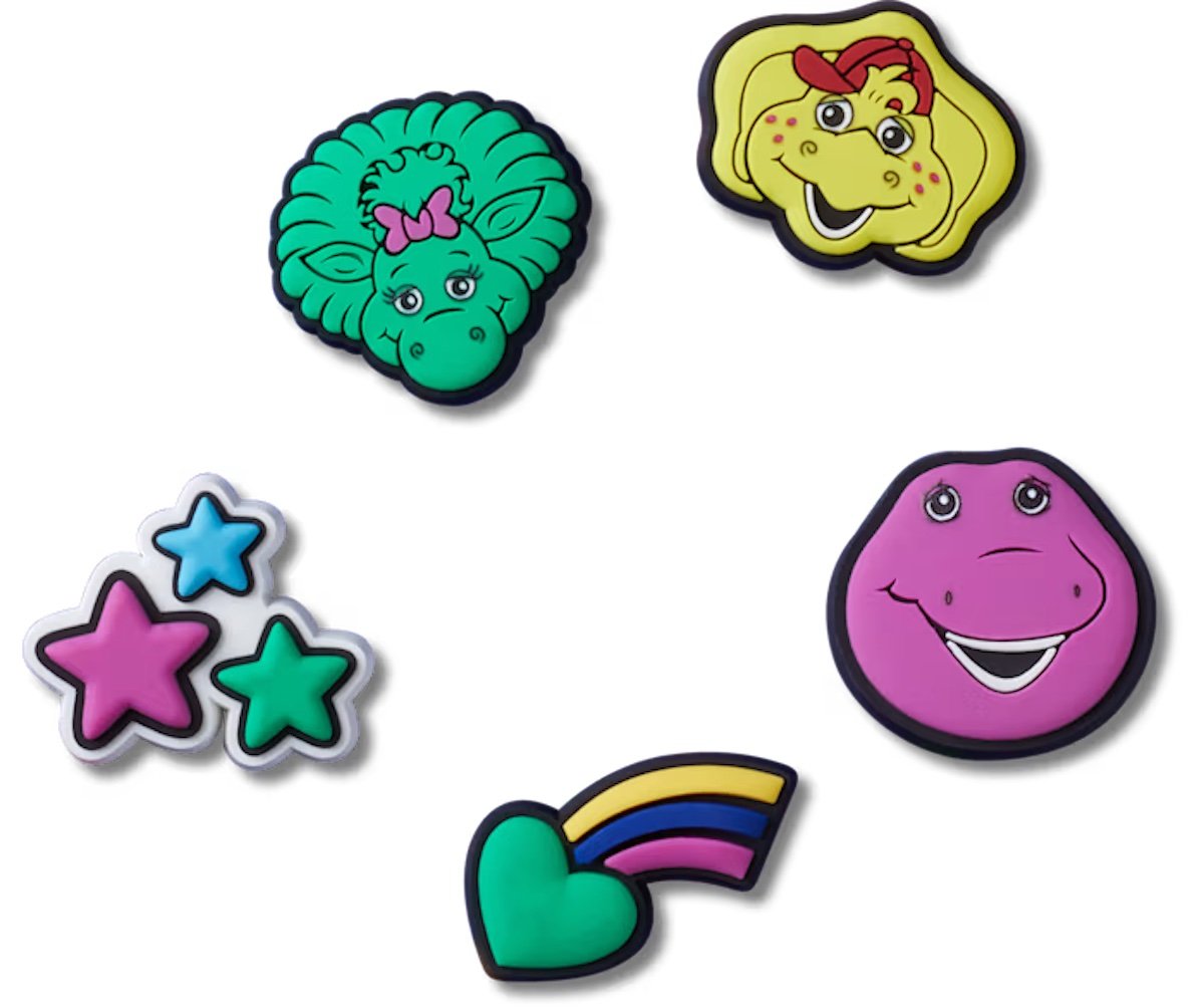 Five Crocs Jibbitz charms celebrating characters, rainbows, and stars from Barney and Friends