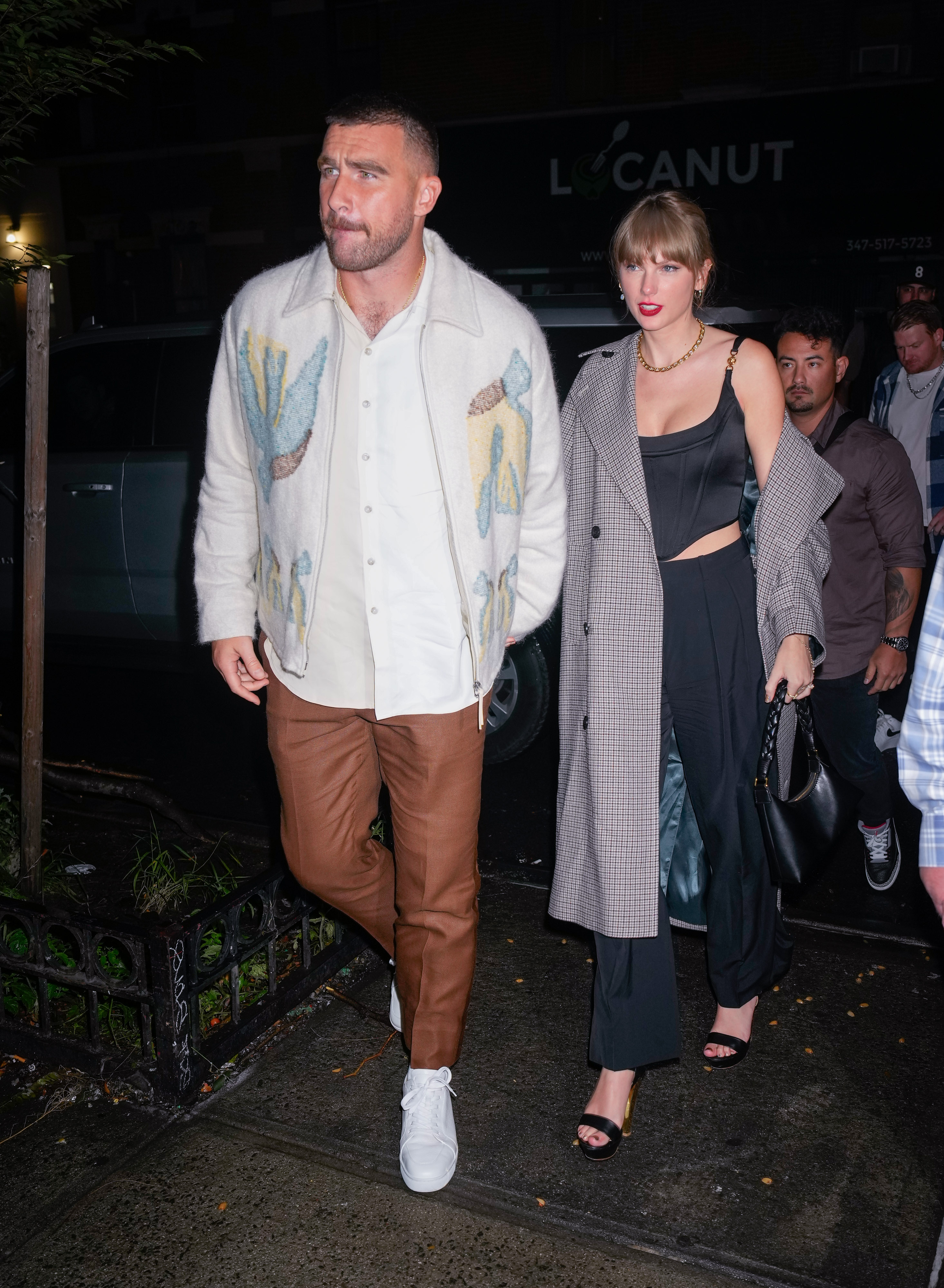 Travis Kelce and Taylor Swift arrive at an SNL afterparty in October 2023 in New York City