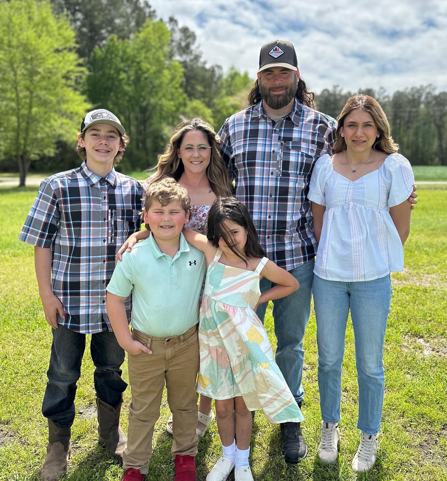 David posed with Maryssa Eason, wife Jenelle, and the other children