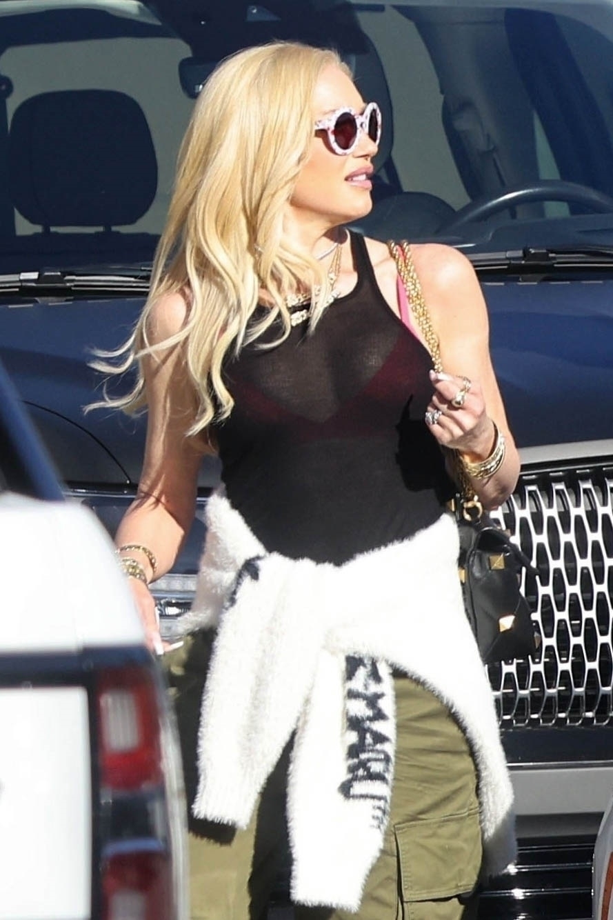 Gwen's pink bra could be seen through her black shirt