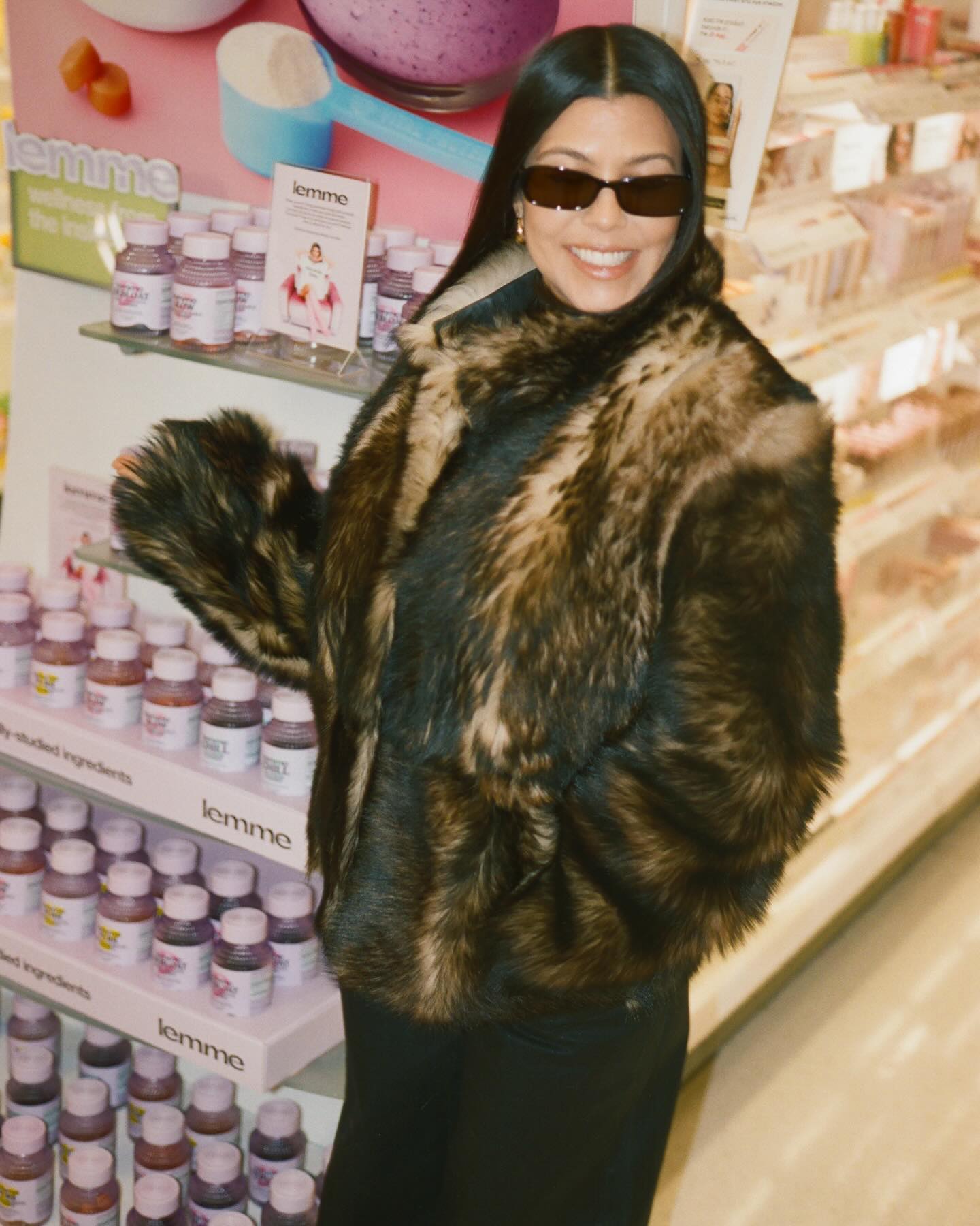Kourtney wore a fur coat next to the Lemme store