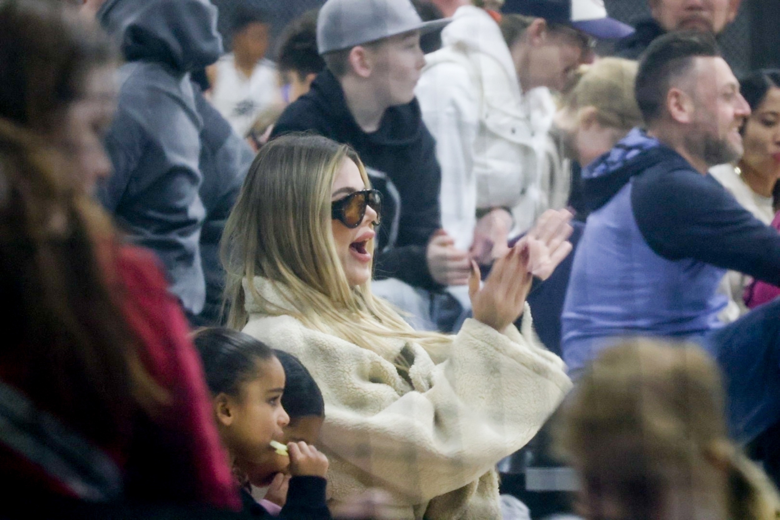 Khloe cheered from the stands with daughters True and Dream