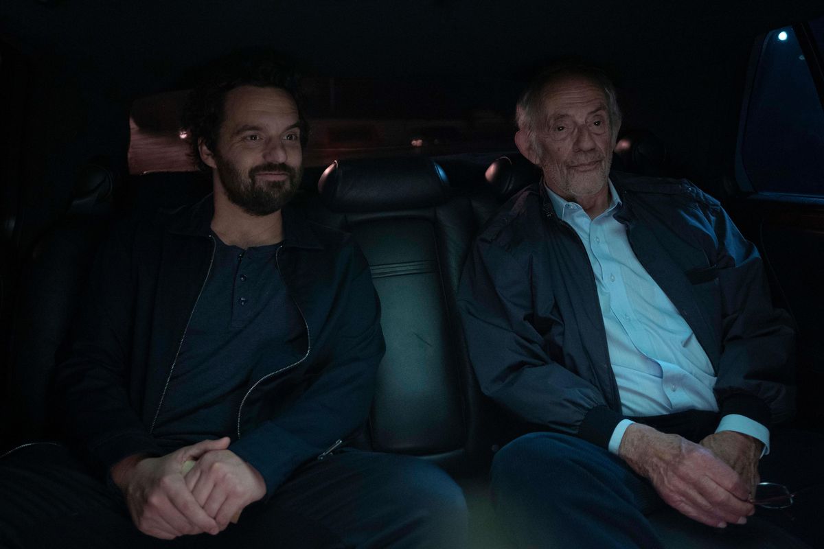 Tommy (Jake Johnson) sits in a darkened car next to his long-lost father (Christopher Lloyd) in Johnson’s comedy Self Reliance