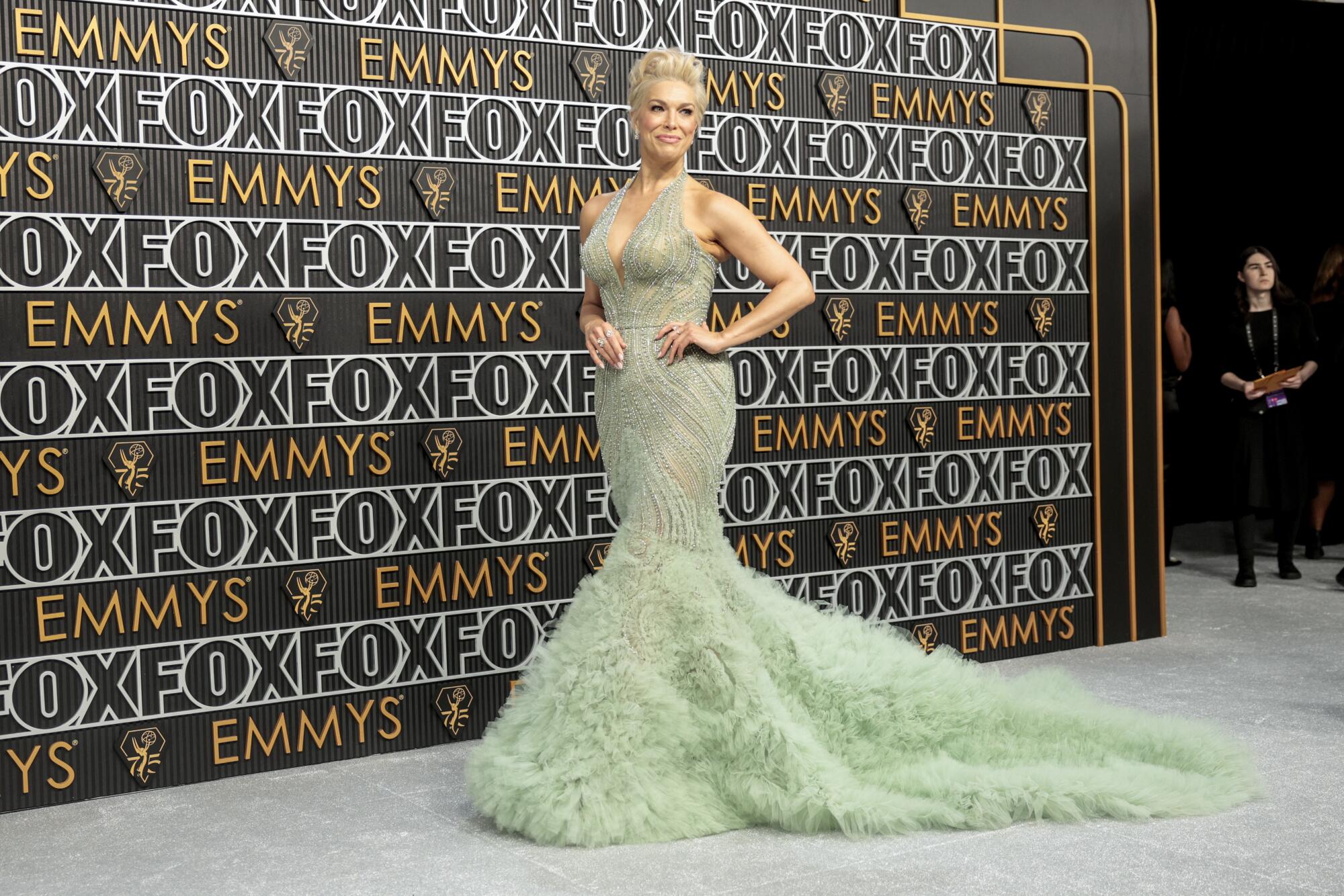 Hannah Waddingham wears a green dress on the Emmys red carpet. 