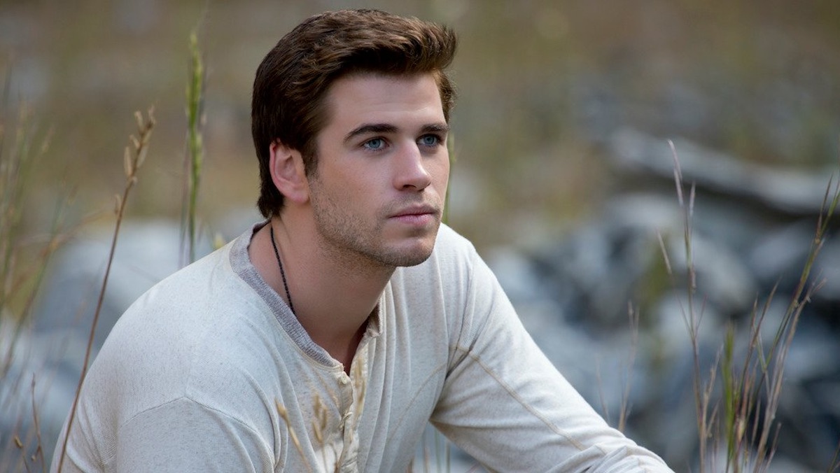 Liam Hemsworth as Gale in a white shirt in The Hunger Games